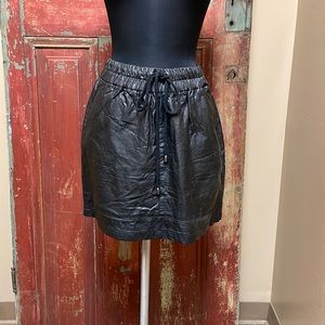 Selena Gomez faux leather mini skirt